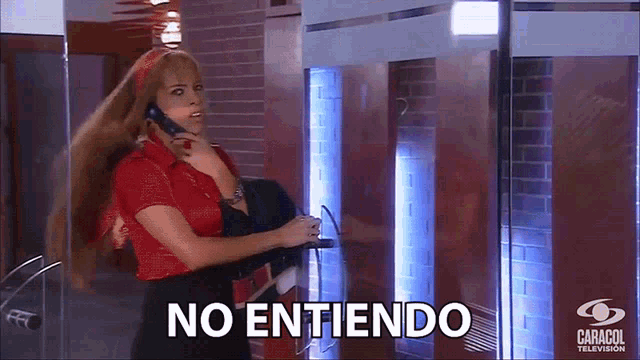 a woman in a red shirt is talking on a phone and the word no entiendo is on the bottom