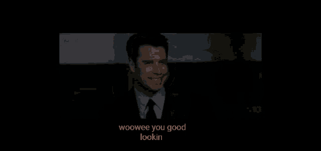 a man in a suit and tie is smiling with the words woowee you good lookin below him .
