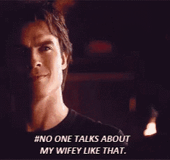a man says " no one talks about my wifey like that " in a dark room