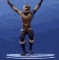 a statue of a man with his arms in the air is standing on a platform .