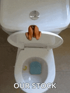 a toilet with the lid open and the words `` our stock '' written on the bottom .
