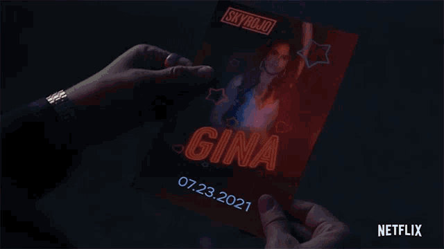 a person is holding a poster that says gina