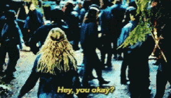 a woman walking in a crowd with the words hey you okay