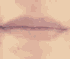 a close up of a person 's mouth with their tongue out