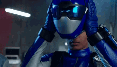 a person wearing a blue helmet and gloves has a watch on their back that says ' a ' on it