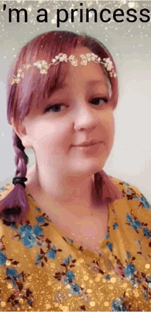a woman with purple hair is wearing a flower crown and the words i 'm a princess