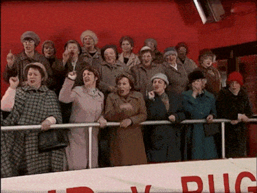 a group of women standing in front of a sign that says plug on it