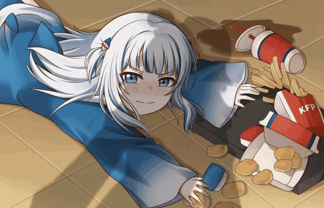 a girl is laying on the floor next to a box of kfc