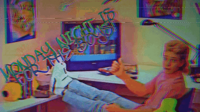 a man sits at a desk with his feet up and a sign that says monday night crew