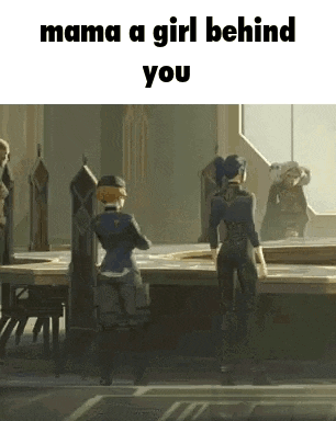 a girl is standing in front of a table in a room with a group of people .