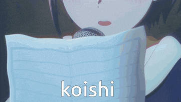 a girl is singing into a microphone and the word koishi is on the bottom right