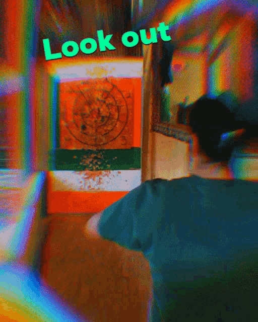 a blurry picture of a person aiming a dart at a target with the words look out above them