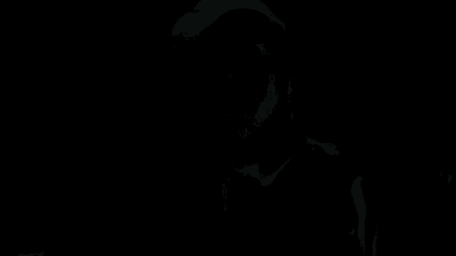 a man with a beard and a woman looking at each other