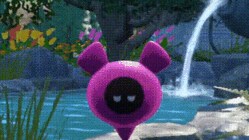 a purple pig with a black face is standing next to a waterfall .