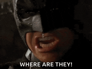 a close up of a person wearing a batman mask saying where are they .