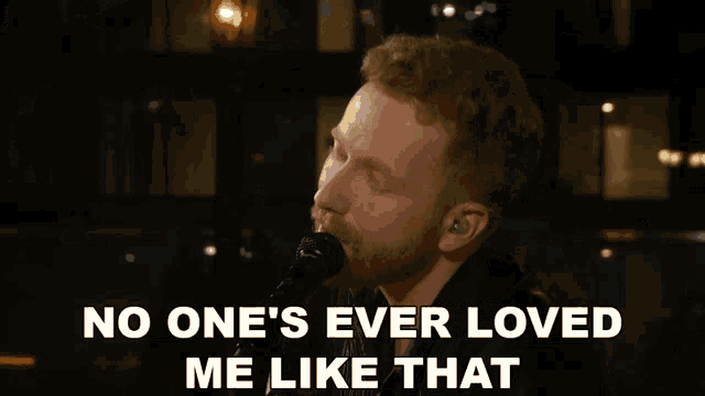 a man singing into a microphone with a caption that says no one 's ever loved me like that