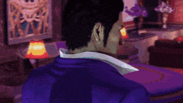 a man in a blue suit and white shirt is standing in a room