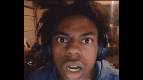 a man wearing headphones is making an angry face