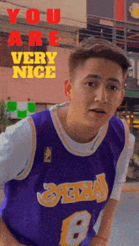 a man wearing a purple jersey with the number 8