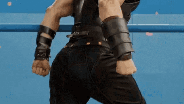 the back of a man in a superhero costume is shown .