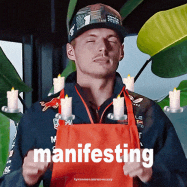a man wearing a red apron with the word manifesting on the front