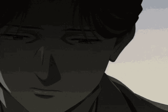 a close up of a man 's face with a shadow on his face