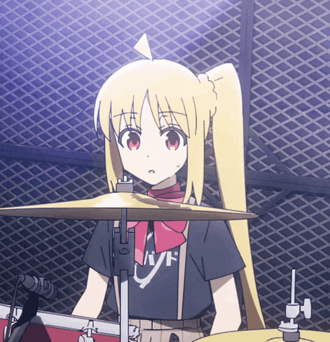 a girl playing drums wearing a black shirt that says band