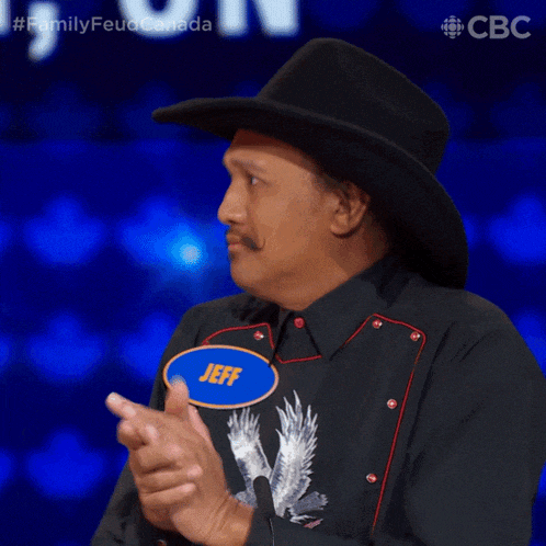 a man wearing a cowboy hat and a shirt that says jeff on it