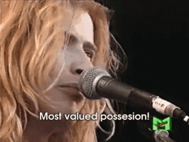 a woman singing into a microphone with the words most valued possession written below her