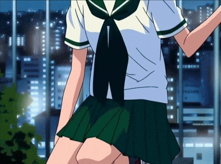 a girl in a green and white school uniform is kneeling down