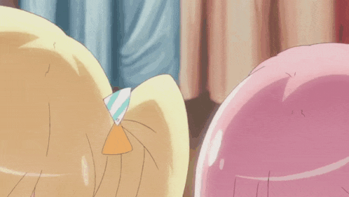 a close up of a cartoon character with a yellow head and a pink body