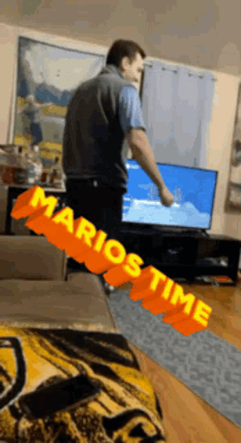 a man standing in front of a television with marios time written in orange letters