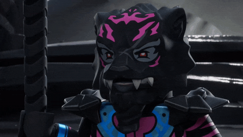 a close up of a toy with a tiger face