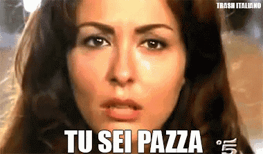 a close up of a woman 's face with the words tu sei pazza in white letters