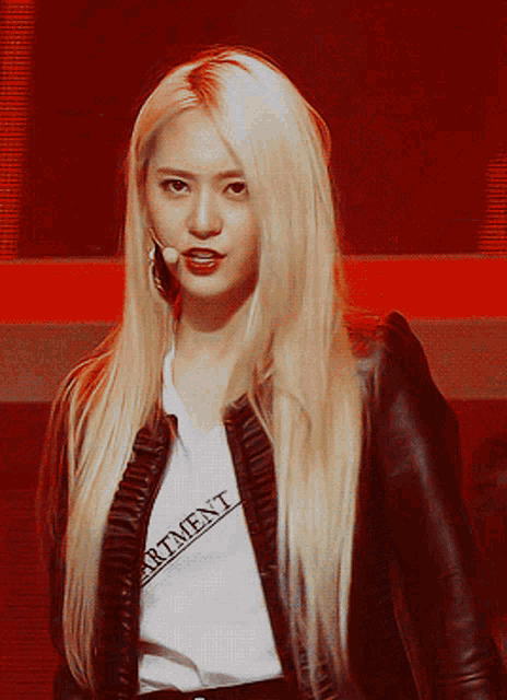 a woman with long blonde hair is wearing a white shirt that says apartment