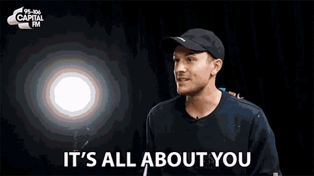 a man says it 's all about you in front of capital fm