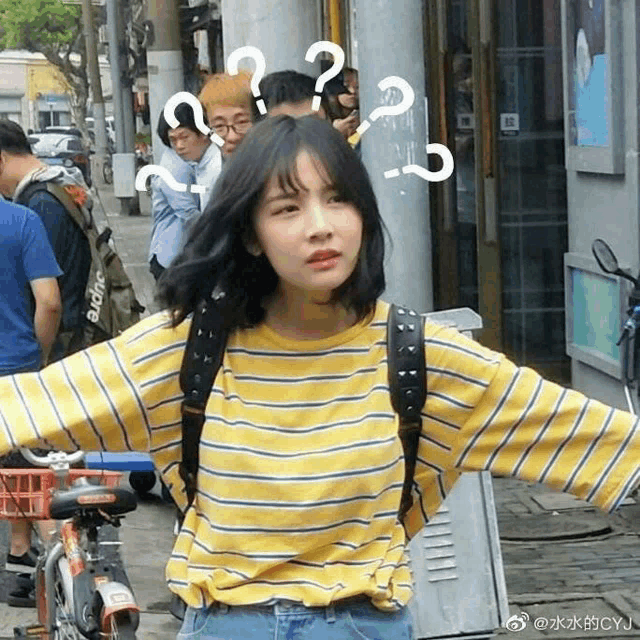 a girl wearing a yellow striped shirt has a question mark on her forehead