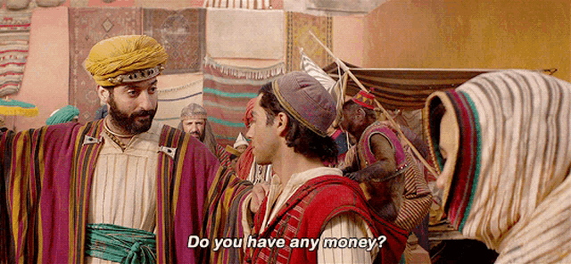a man in a turban talks to another man and says " do you have any money "