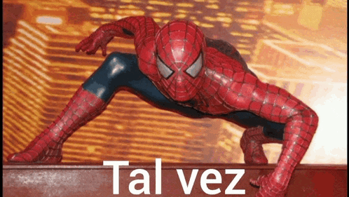 a spider man statue is crawling on a wall with the words tal vez below him