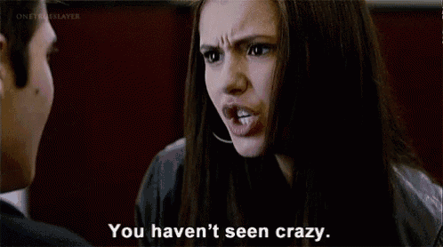 a man and woman are looking at each other and the woman is saying you haven 't seen crazy