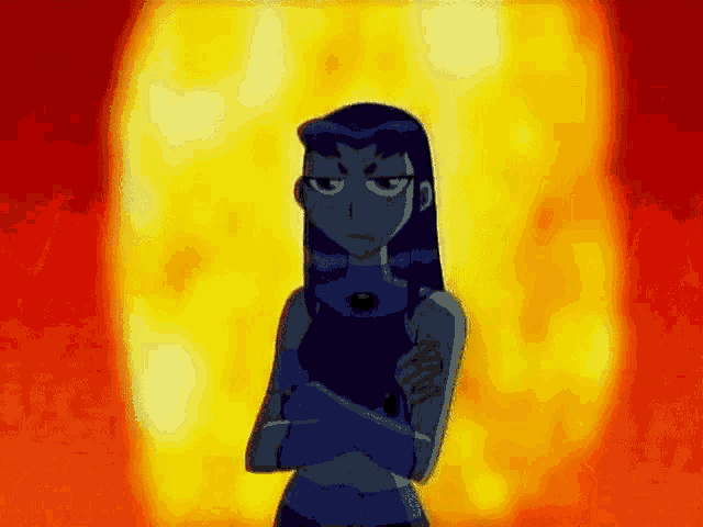 starfire from the teen titans go is standing in front of a fireball with her arms crossed .