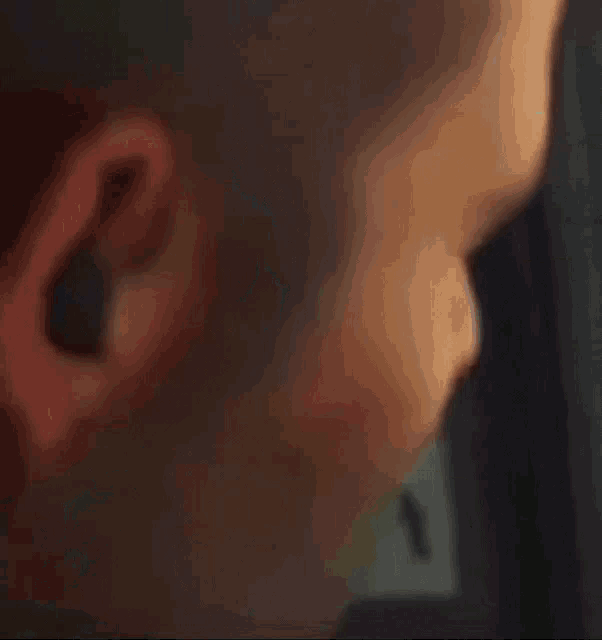 a man with a mask on his face is looking through a car window