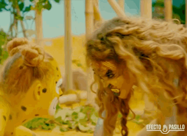 a woman in a leopard costume is looking at another woman