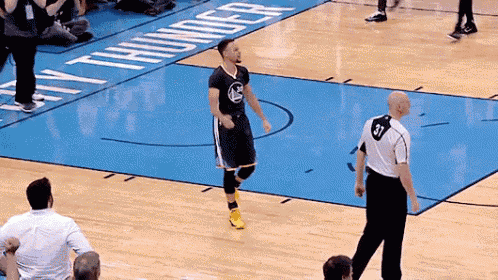 a basketball player wearing a number 31 jersey stands on a court