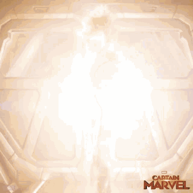 a poster for the movie captain marvel shows a woman standing in a room
