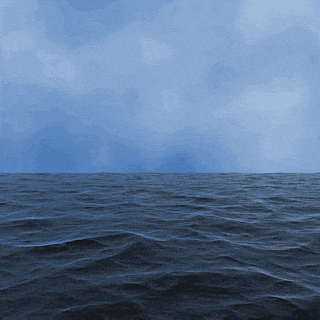 a large body of water with waves and a cloudy sky in the background
