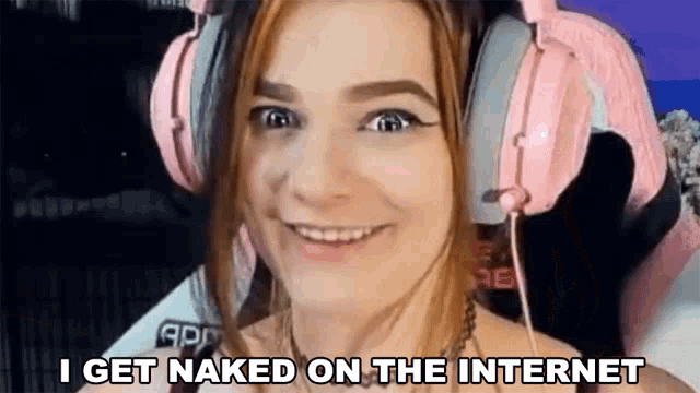 a woman is wearing pink headphones and smiling while talking on the internet .