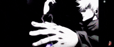 a close up of a person 's hand with purple lightning coming out of it .