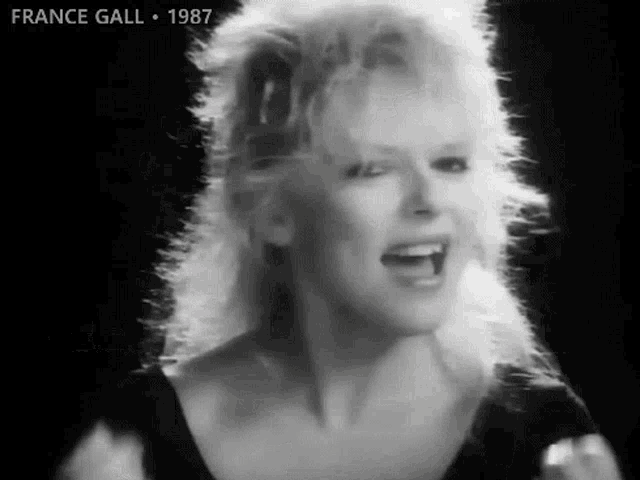 a black and white photo of france gall singing
