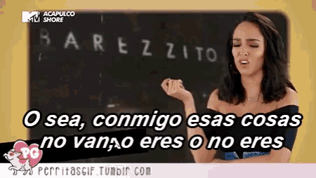 a woman is standing in front of a blackboard that says acapulco shore